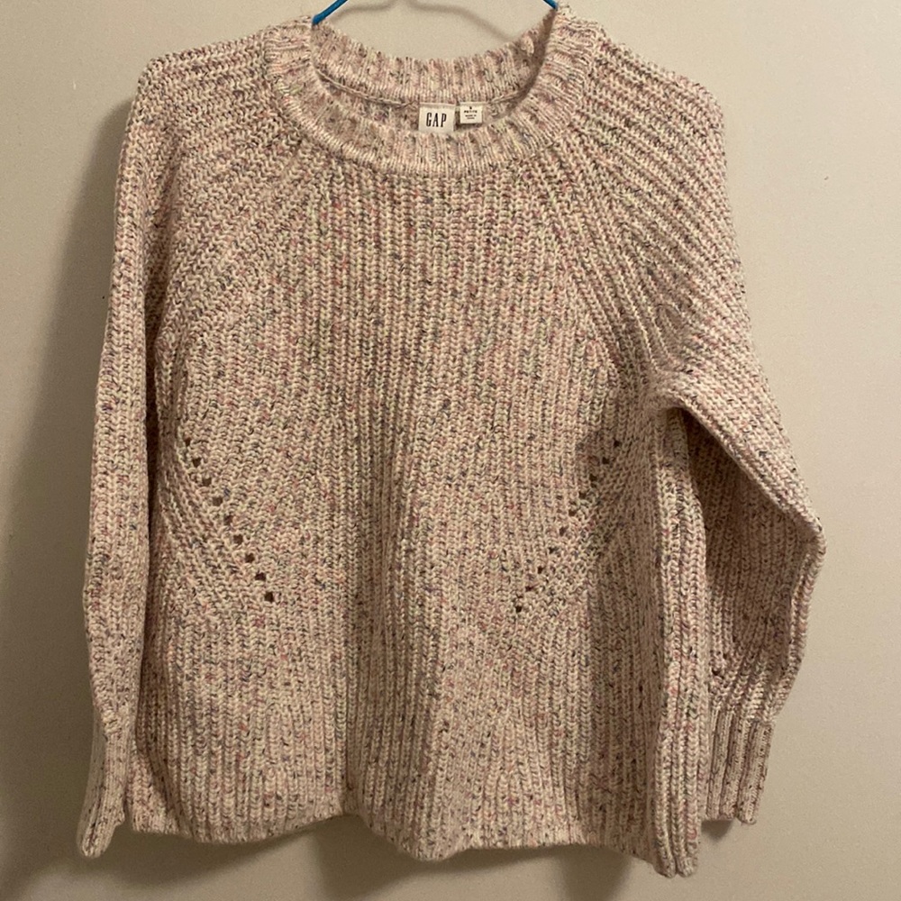 The brand of the sweater is GAP. The color of the sweater is cream and confetti.